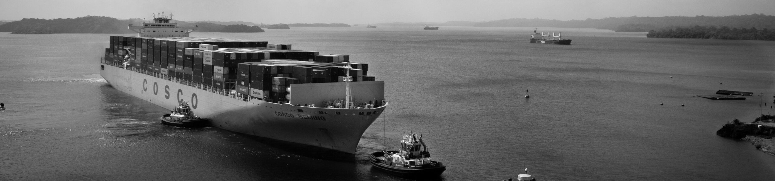 Pilot boats helping a freighter navigate a harbor to illustrate Continuous Strategy